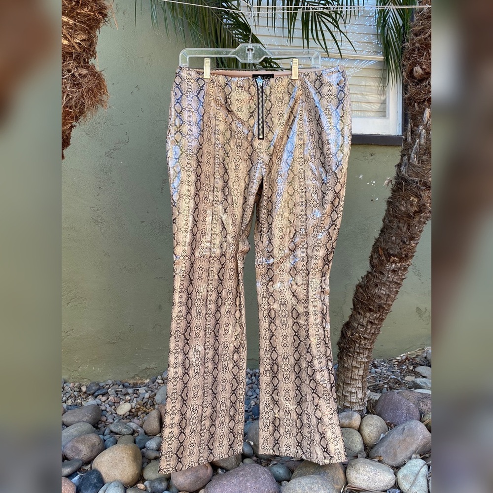 Club Exx snake print pants! Minor bootleg and pleather feel. Fits like a size L.